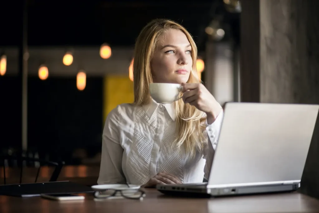 Woman entrepreneur working peacefully at a café with laptop
